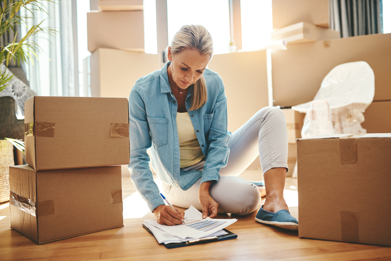 woman marking off moving checklist