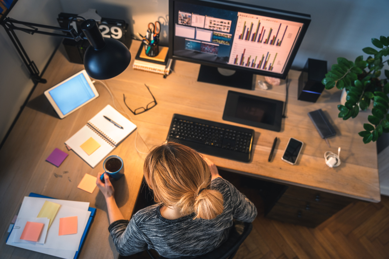 woman working on desk at night